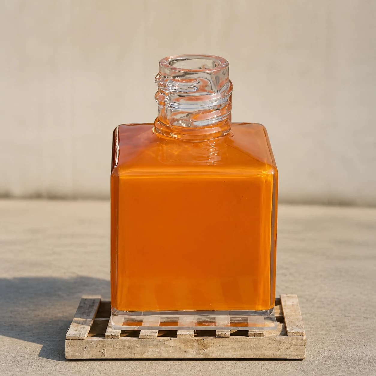 Finished oversized orange perfume bottle replica