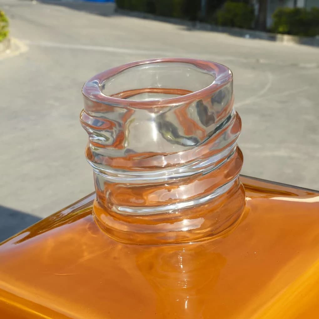 Close-up of the clear neck detail on the oversized perfume bottle replica