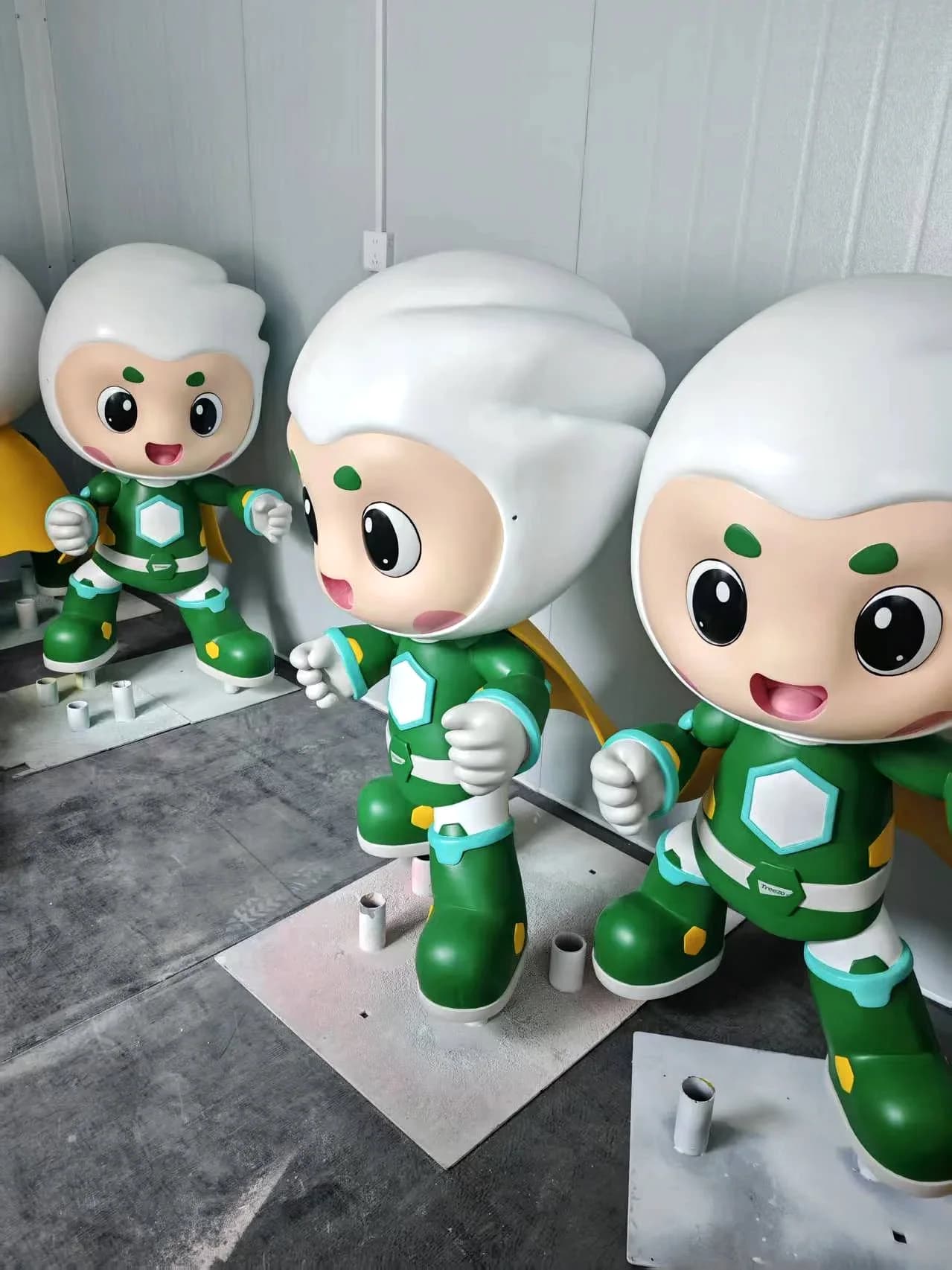 Finished Treezo mascot sculptures showing consistent color and character details