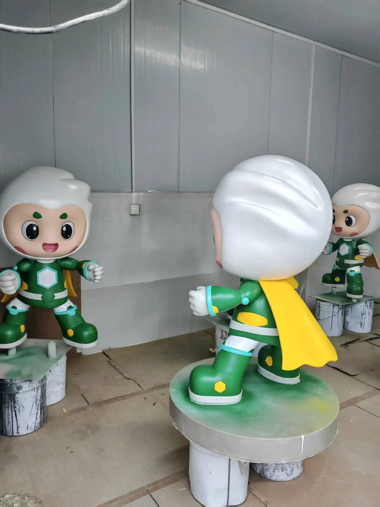 Rear and side view of the Treezo mascot sculpture