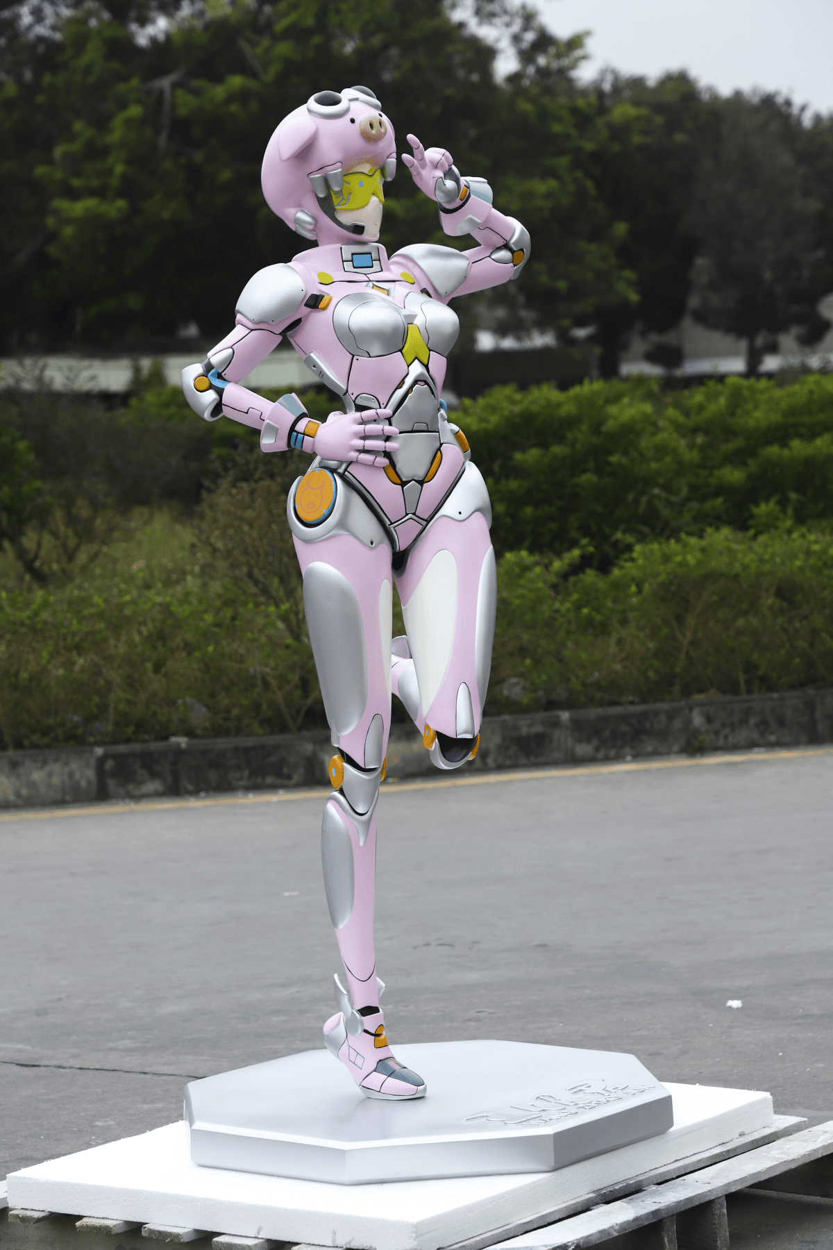 Detailed character sculpture with pink and metallic finishes, full front three-quarter view