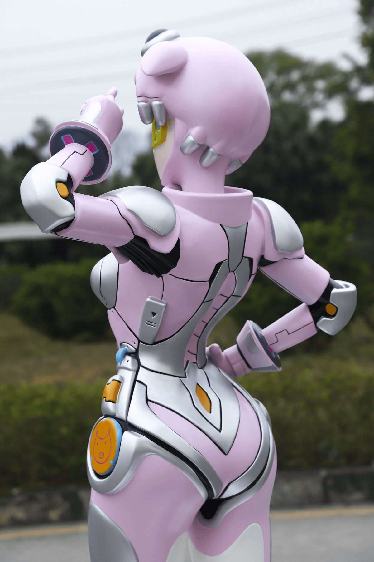 Close-up rear view showing layered character sculpture surface details