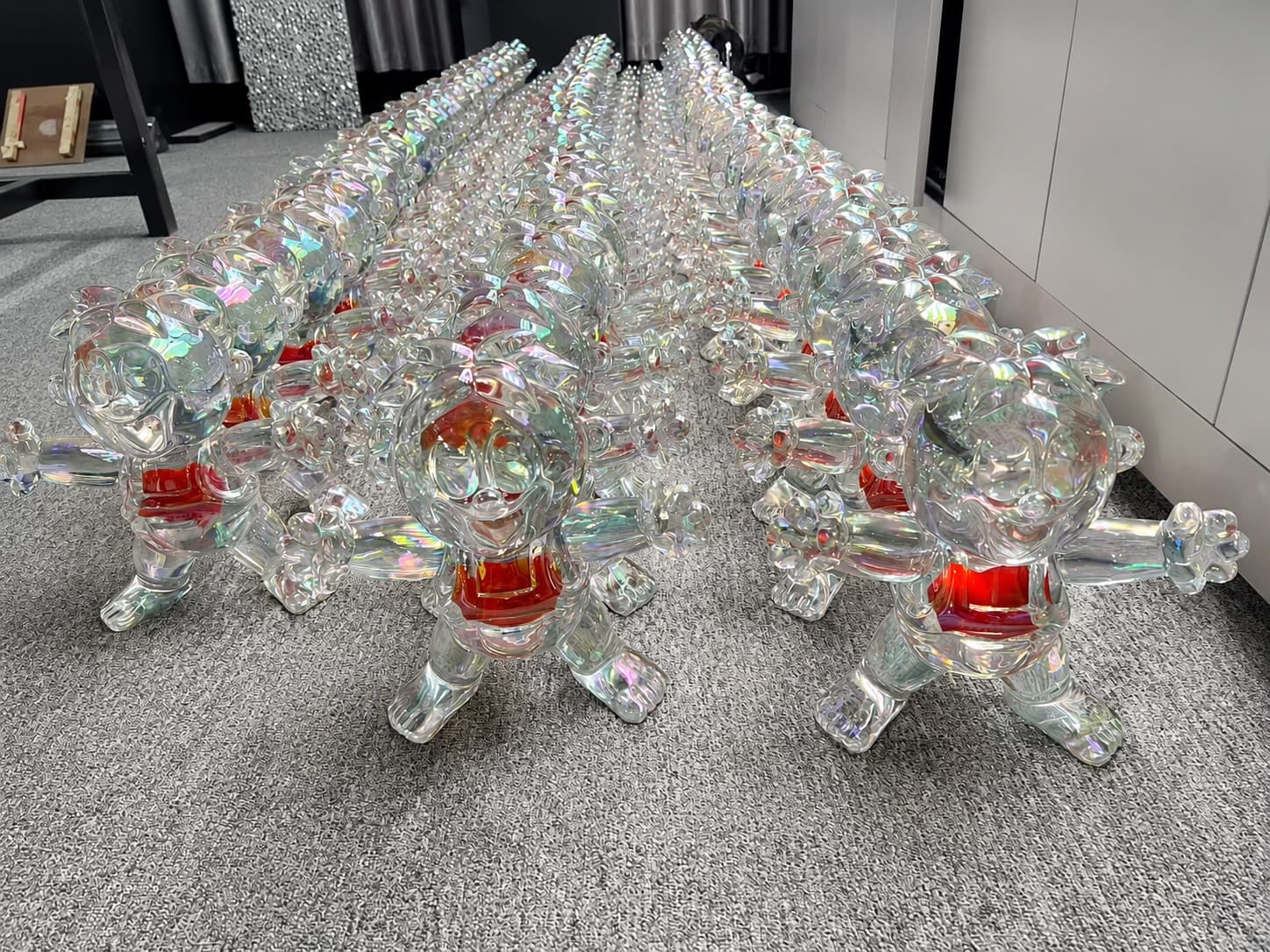 Multiple transparent sculptural figures produced as a repeatable series