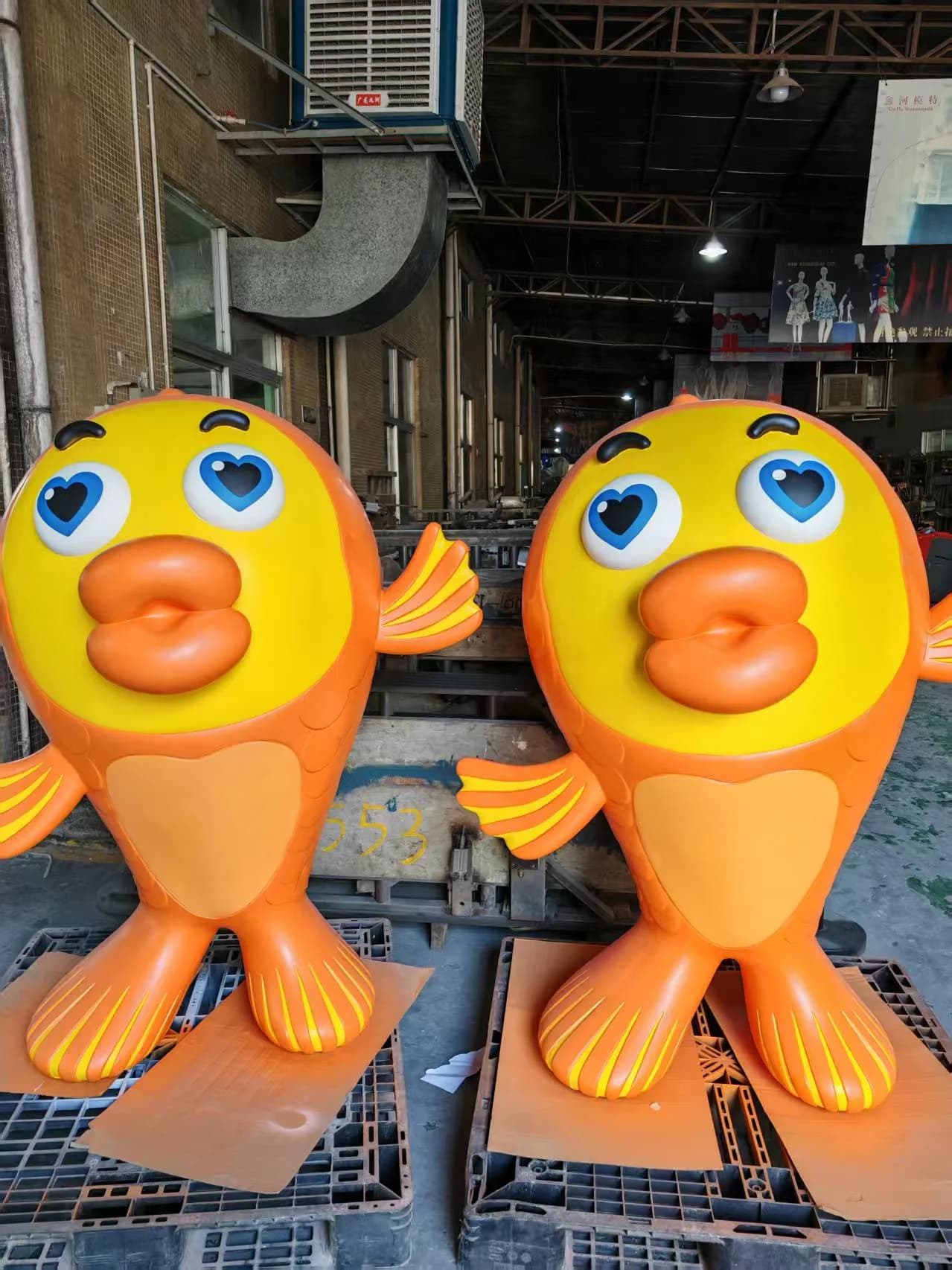 Matching custom fiberglass character sculptures in repeat production at YAVIS workshop